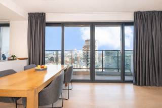 In the heart of the European Quarter on Chaussée d’Etterbeek, discover a high-floor apartment combining spectacular views, natural light and modern comfort.<br />Located on the 16th floor of a 2014 building, this ± 94 sqm property impresses from the entrance hall featuring a security door. The bright living area opens onto a pleasant ± 8 sqm terrace, a true outdoor extension with open views over Brussels. The fully equipped open-plan kitchen flows seamlessly into the living space.<br />The night area offers two comfortable bedrooms (± 15 sqm and ± 10 sqm), a bathroom, a shower room, a laundry room and a separate toilet. Cellar no. 41 included.<br />Quality technical features: double glazing, double-flow ventilation system, thermostat, bicycle and stroller storage rooms.<br />Secure investment: currently rented at €1,742/month (lease started on 01/07/2024 – 3-year term). Charges ± €157/month. EPC rating B.<br />Indoor parking space (-3P10) mandatory purchase: €30,000.<br />A bright, well-maintained property in a highly sought-after area close to European institutions, shops and excellent transport connections. Measurements given for information purposes only.