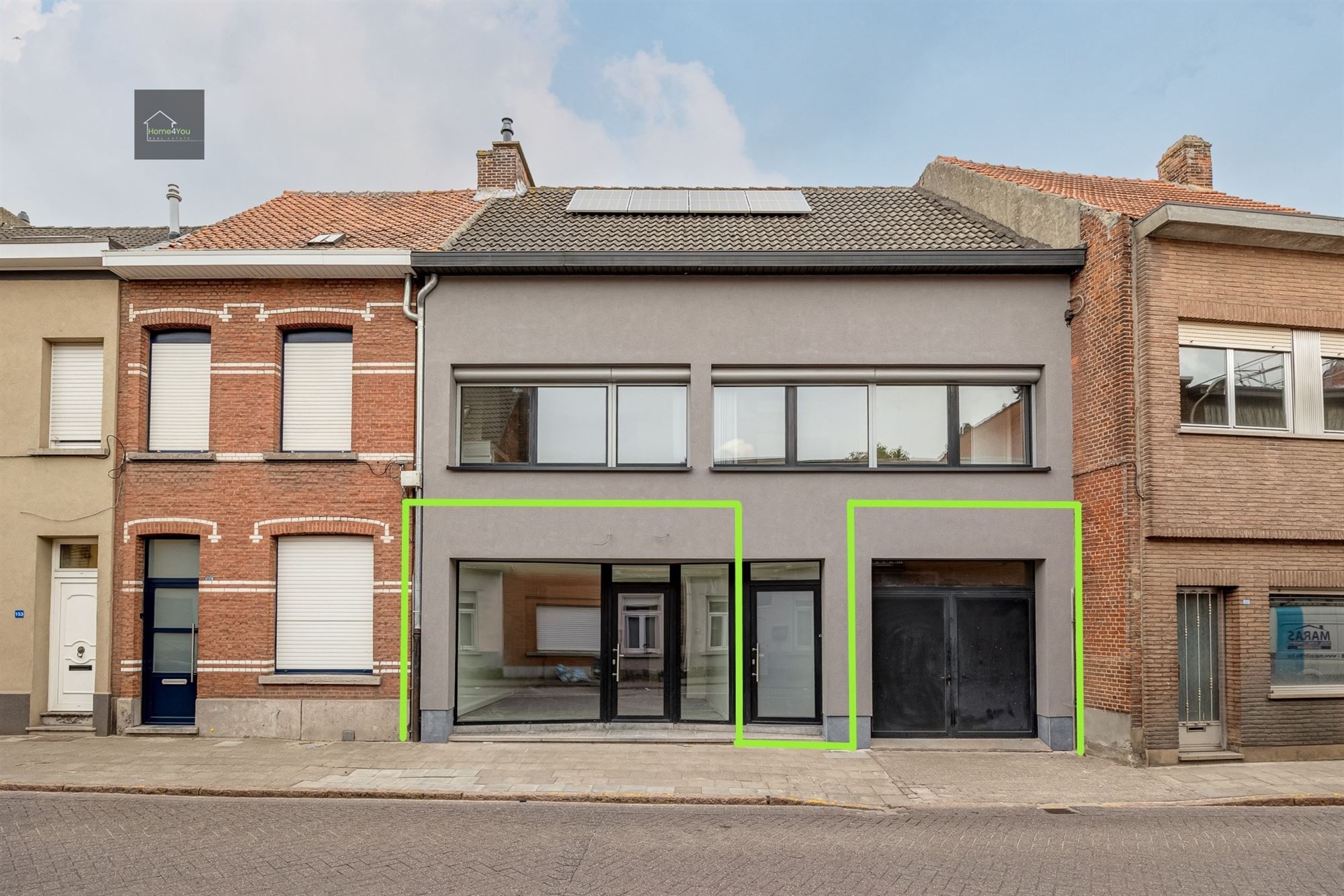Gelijkvloers handelspand met garage en privatieve tuin - foto 1