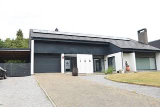 Your Dream Home: Space, Comfort and Homeliness in Koersel-Beringen! NEW AT ANIMOVASTGOED!!! Welcome home to this charming country house on an impressive plot of 20a86 in Koersel-Beringen! If you dream of a spacious home full of warmth, comfort and functionality, perfect for both your family life and professional ambitions, then look no further. This solidly built house from 1975 exudes tranquility and offers a wealth of possibilities. The house has a full basement, which guarantees plenty of storage space and extra ease of use. Once inside through the inviting entrance hall, you are led to the bright living space that flows seamlessly into the cozy dining area. The place for family moments! The separate kitchen was modernized in 2015 and is a real treat for every home chef. The night hall gives access to no fewer than four comfortable bedrooms, one of which can be ideally used as a practice room or home office, with the necessary privacy. In addition, the house has a bathroom with bath, a separate toilet and a handy storage/laundry room, complete with an extra shower. Outside you can fully enjoy the peace and space. The garage with sectional door and the carport offer ample parking. The veranda and the covered terrace are perfect places to relax, while you look out over the extensive, green garden, a paradise for relaxation and outdoor activities. The attic space is accessible via an access hatch in the garage, which now serves as storage, but with potential for additional living space after finishing. This house is also equipped with modern facilities for comfort and energy efficiency: five air conditioning units will be installed in 2023 (including in the living room and all bedrooms) for a pleasant climate all year round. With 17 solar panels and a digital meter, you contribute to a sustainable future, and some windows were fitted with triple glazing in 2019 for optimal insulation. In short, this is the ideal family home: spacious, well-maintained, with the unique opportunity for a home practice, and strategically located near all amenities. A house that you will immediately fall in love with! Interested? Contact us for a viewing and be surprised by the warm atmosphere and versatility of this special property!