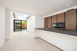 <p><span>This recently renovated home is located on a quiet, tree-lined one-way street (30-zone), with the public Borgersteinpark at its end. The very favorable EPC score of 64 kWh/m²/year (Label A) was achieved by installing thick layers of insulation, radiant floor heating, a condensing boiler, 6 solar panels, and new PVC windows. All walls have already been painted white. In terms of luxury and comfort, highlights include a metal door with glass (living room), profiled overlay doors, LED ceiling spotlights, a coat closet, electric roller shutters, and a Bora cooktop. The large living room, with its open kitchen and dining area, is completely open-concept. The custom kitchen, featuring wood cabinet fronts and an island (with seating), is equipped with Bosch appliances: a large freezer, a large refrigerator, a combi-oven, a microwave, and a dishwasher. The beautiful Bora induction cooktop with integrated range hood costs approximately €4,000. Through the sliding window, you look out onto a fenced-in lawn with a patio (outdoor faucet) and enjoy privacy and a view of the neighbors’ palm trees. The storage/laundry room is separated from the toilet area—which features a vanity unit and a wall-mounted toilet—by a partition. The bathroom has space for a double vanity with wooden fronts, a mirror with integrated lighting, a tall cabinet (black interior), a decorative radiator, and a walk-in shower with a glass wall. The two large rooms on the first floor are complemented by a third bedroom (with two Velux windows), which</span><span> occupies</span><span>the entire</span><span><sup>second</sup></span><span> floor under the new roof and is enclosed at the bottom of the stairs by a sliding glass door.</span></p><p><span> </span></p>