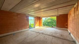 Moderne halfopen nieuwbouwwoning in ruwbouw – Singelstraat 69 in Heusden-Zolder!<br /><br />Moderne nieuwbouwwoning in ruwbouw met 3 slaapkamers, gelegen in een rustige en aangename omgeving in Berkenbos. Dankzij de gunstige ligging zijn winkels, scholen, belangrijke verbindingswegen en voorzieningen vlot bereikbaar.<br /><br />Deze stijlvolle halfopen bebouwing wordt opgetrokken in een lichte gevelsteen en combineert een strakke, moderne uitstraling met een praktische indeling en biedt de toekomstige eigenaar de mogelijkheid om de verdere afwerking volledig naar eigen smaak en wensen te bepalen.<br /><br />De woning beschikt over een bruto bewoonbare oppervlakte van 180 m² en is gelegen op een perceel van 4,22 are.<br /><br />Via de inkomhal komt men binnen in de woning, waar meteen de open en lichtrijke leefruimte tot zijn recht komt. De ruime zithoek en eetplaats sluiten mooi aan op de moderne keuken, waardoor een aangenaam en ruimtelijk geheel ontstaat. De grote raampartijen zorgen voor een overvloed aan natuurlijk licht en creëren een fijne verbinding met het terras en de achterliggende buitenruimte. Aansluitend aan de keuken bevindt zich een praktische berging, ideaal voor extra opslag en huishoudelijke voorzieningen. Verder is er op het gelijkvloers een apart toilet voorzien.<br /><br />Via de vaste trap bereikt men de eerste verdieping en bevinden zich 3 slaapkamers, waarvan één slaapkamer beschikt over een dressing, evenals een badkamer en een 2de toilet.<br /><br />De woning wordt als ruwbouw aangeboden en het perceel wordt vlak afgewerkt, zodat de toekomstige eigenaar meteen met de verdere aanleg en aanplanting kan starten.<br /><br />Ook buiten is er voldoende ruimte om volop van het wonen te genieten. Achteraan bevindt zich een ruim terras dat rechtstreeks aansluit op de leefruimte en toegang geeft tot de buitenruimte. De hedendaagse vormgeving met het strakke volume en het platte dak zorgt bovendien voor een moderne uitstraling.<br /><br />Pluspunten:<br />- Moderne en strakke architectuur;<br />- Rustige ligging in Berkenbos;<br />- 180 m² bruto bewoonbare oppervlakte;<br />- Grondopp. van 4,22 are;<br />- 3 slaapkamers, waarvan 1 met dressing;<br />- Ruime en aangename leefruimte;<br />- Regenwaterput ;<br />- Ideaal voor wie een moderne nieuwbouwwoning naar eigen smaak wil afwerken!<br /><br />Prijsindeling: <br />150.000 euro (grondwaarde) x 12% registratierechten = 18.000 euro <br />149.000 euro (constructiewaarde) x 21% btw = 31.290 euro<br />Totaalprijs excl. notariskosten = 348.290 euro<br /><br />Een interessante opportuniteit voor wie op zoek is naar een moderne halfopen nieuwbouwwoning in ruwbouw en de verdere afwerking volledig naar eigen wensen wil bepalen!<br /><br />Interesse? Voor een bezichtiging ter plaatse of meer info, bel ons op 078/78.78.70, of kom gerust binnen in ons kantoor — je bent steeds welkom!