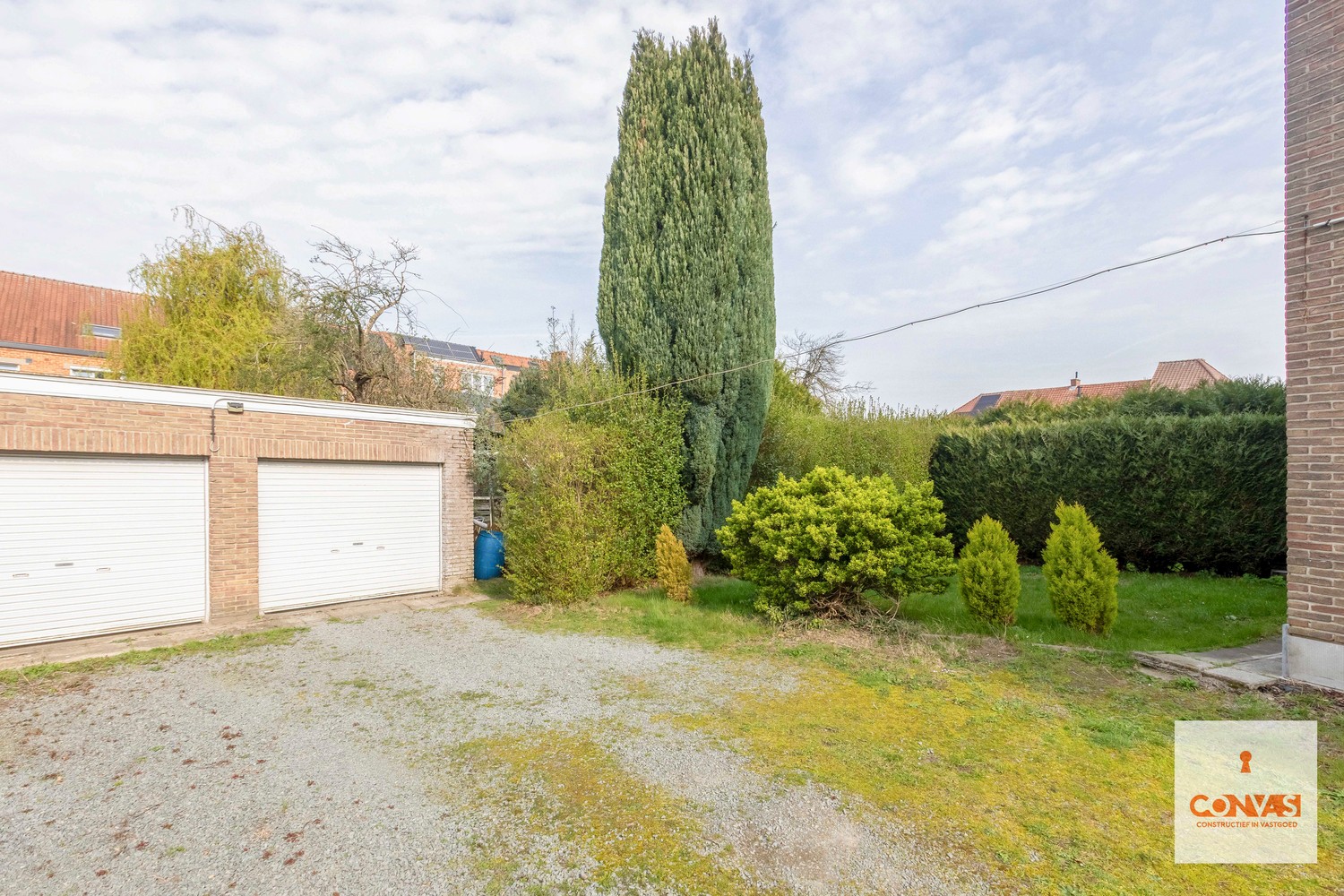 Opbrengsteigendom met twee appartementen, tuin en garageboxen - photo 4