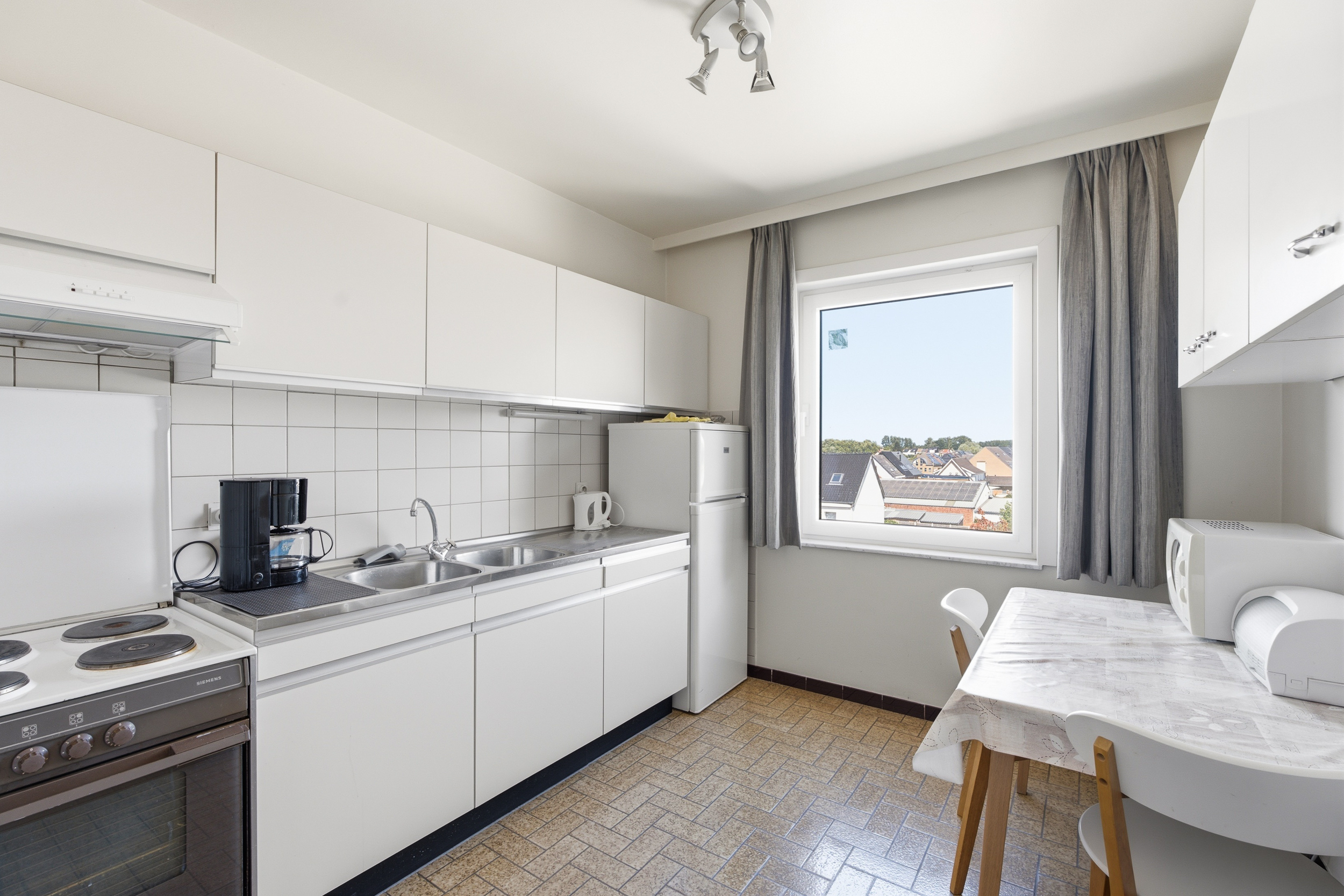 Lichtrijk 2-slaapkamerappartement op 3de verdiep in Lebbeke - foto 4
