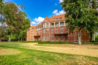 <p><span>Nestled in the heart of the beautiful Groot Park, surrounded by centuries-old trees and greenery, where peace and quiet reign, and just a stone’s throw from Leuven, we are pleased to offer this energy-efficient apartment for sale. </span></p><p><span> </span></p><p><span>This redeveloped historic site was transformed by the renowned developer Virix into an exclusive residential community with a strong focus on heritage, green spaces, and quality of life. </span></p><p><span> </span></p><p><span>This luxurious apartment, with a living area of 96 m², is located on the second floor of the charming pavilion named Sint Vincentius, which was completed in 2025. The apartment features an entryway with a coat closet and guest restroom, a bright living room with an open, fully equipped kitchen, a practical storage room, an open-concept home office, and a bedroom with an en suite bathroom. </span></p><p><span> </span></p><p><span>A highlight not to be missed is the pleasant 8 m² east-facing terrace, which overlooks the beautiful park and offers a daily oasis of tranquility.</span></p><p><span> </span></p><p><span>You’ll also enjoy an exceptional range of communal facilities, including the wellness center with a 16-meter-long heated pool, a sauna, and a fully equipped fitness room—all exclusively accessible to residents. In addition, bicycle storage is included in the price, and there is the option to purchase a parking space and/or a basement unit.</span></p><p><span> </span></p><p><span>In short, this apartment offers a rare combination of contemporary living comfort in a historic setting. A unique opportunity for those seeking luxurious living, energy efficiency, high-quality architecture, and tranquility, without compromising on accessibility and proximity to Leuven.</span></p><p><span> </span></p><p><span>This apartment is being offered fully finished, including flooring and paintwork. Sale subject to registration fees. </span></p><p><span> </span></p>
