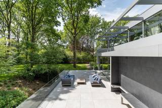 <strong><em>This exceptional property is exclusively offered via a private sale process, with bids invited from € 1,895,000.</em></strong><br /><br />This exceptional design villa, set on a highly private plot of approximately 30 ares in the prestigious surroundings near the Golf Club and Lake of Keerbergen, distinguishes itself through its timeless modernist architecture — defined by clean volumes, refined material choices and sweeping glazed facades that bring the surrounding greenery indoors like a living painting. The residence was conceived around the philosophy of 'living within nature', where light, space and privacy are paramount. An architectural masterpiece for the connoisseur of pure lines, exclusivity and contemporary elegance.<br /><br />Key features of this unique property:
<ul>
	<li>Exceptionally quiet and private setting on a plot of approximately 30 ares</li>
	<li>Within close proximity of the Keerbergen Golf Club and Lake</li>
	<li>Generous, light-filled living space with integrated home office</li>
	<li>Luxurious open-plan kitchen fully equipped with built-in appliances</li>
	<li>Exclusive wine fridge seamlessly integrated into the living area</li>
	<li>3 full-sized bedrooms, including one on the ground floor</li>
	<li>3 elegant bathrooms</li>
	<li>Elevator shaft provision (lift-ready)</li>
	<li>Fully integrated home automation system for optimal living comfort</li>
	<li>Underfloor heating throughout</li>
	<li>Separate ventilation systems for the main residence and basement</li>
	<li>Alarm system</li>
	<li>Sun-drenched terraces offering maximum privacy</li>
	<li>Sun terrace with swim spa, shower and steam bath provision</li>
	<li>Cold storage room</li>
	<li>Exceptionally spacious multifunctional basement level</li>
	<li>Car lift to the basement</li>
	<li>Underground garage for up to 12 vehicles</li>
	<li>6 outdoor parking spaces</li>
	<li>Carport</li>
	<li>Dedicated car washing facility</li>
</ul>
Unlimited possibilities for hobby space, wellness &amp; aesthetics, collector vehicles, art lovers &amp; collectors or additional storage.<br />Beneath the entire villa lies a truly impressive multifunctional level that adds exceptional value to the whole. This premium space, finished in a sleek architectural style featuring exposed concrete and designer lighting, offers unparalleled possibilities for collectors of exclusive vehicles, art enthusiasts, entrepreneurs or independent professionals. Thanks to its generous volumes, natural light and flexible layout, this level represents a rare combination of functionality, aesthetics and exclusivity.<br />A unique space where living, passion and enterprise come together effortlessly.<br /><br />A rare combination of luxury, technology, privacy and a prime location in the heart of Keerbergen.<br />For further information, please contact Anne at +32 472 78 40 49 or by email at anne@incignorealestate.be<br /><br /> 