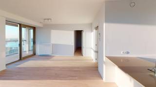 Beautiful corner apartment with panoramic views and a view of the Scheldt. New building complies with very strict energy-efficient regulations. Entrance hall with space for cloakroom. Living space with fully equipped kitchen that gives access to the first spacious terrace that can be closed to enjoy in the mid-season. Living space and bedrooms on parquet floor. Furthermore, a shower room, guest toilet and laundry room with techniques. Spacious storage room on -2 and possibility to rent a parking space on -2 for 100 euros per month.