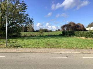 <p>Beautifully located building plot, intended for a detached building, with a surface area of 06a 05ca located in Willebringen (Boutersem).</p><p> </p><p>The plot is situated in a rural residential area (Willebringsestraat next to no. 85) - residential area with a rural character and agricultural area at the rear.</p><p>At the rear, you enjoy a pleasant, panoramic view over rolling meadows (border of Hageland/Hesbaye).</p><p>The centres of Boutersem and Bierbeek are easily accessible by car: quick connections to schools, shops, supermarkets, sports facilities, ...</p><p>Vertrijk station and E40 highway access at 6 min.</p><p> </p><p>The planning certificate, site plan, official advice, and other documentation can be found under downloads.</p><p> </p><p><strong>Regulations:</strong></p><ul><li><p>Intended for a single-family detached home;</p></li><li><p>Ground floor, first floor, and attic floor are permitted - no basement floor.</p></li><li><p>Due to the position of the Fonteinbeek stream along the left plot boundary, a zone non-aedificandum of 5.00 m wide is taken into account.</p></li><li><p>The building zone is set back 6.00 m from the front plot boundary.</p></li><li><p>The building depth is 10.00 m to provide a sufficiently deep garden for the home.</p></li><li><p>The building width is a maximum of 15.00 m.</p></li><li><p>A non-buildable strip of 3.00 m is provided along the right plot boundary.</p></li><li><p>According to the flood map, it is proposed to set the safe floor level at 48 cm above road level (see low chance of flooding due to climate change);</p></li><li><p>No underground volumes may be built, except in exceptional cases where they can be adequately protected or used as a (temporary) buffer or retention area;</p></li><li><p>No openings below the safe floor level;</p></li><li><p>New paved surfaces must be limited to the strict minimum and preferably executed using water-permeable materials;</p></li><li><p>A native high-stem tree must be planted on the plot during the first planting season following the date on which the house reaches the wind-tight stage;</p></li><li><p>Excess soil and demolition materials must be removed to an approved landfill site.</p></li></ul>