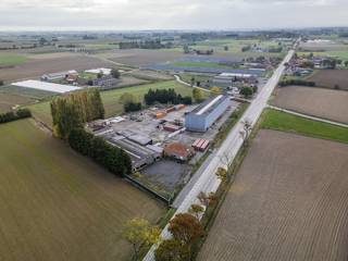 Agricultural site for sale in Oostvleteren. The total land area is approximately 13,534 m² and is equipped with various warehouses and a...