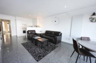 Let yourself be seduced by this pleasant and bright two-bedroom apartment with breathtaking frontal sea views, located in the popular Residence Zeezicht in Mariakerke, Ostend.<br />This residence offers a unique combination of comfort, tranquility, and a holiday feeling, and boasts numerous amenities, including a heated indoor pool and a sunny courtyard where you can peacefully enjoy the sea air.<br />Located on the ground floor, the apartment features a bright living and dining area with direct access to a spacious private terrace overlooking the pool – the ideal place to unwind after a walk on the beach or a refreshing dip in the sea.<br />Moreover, the building borders directly on the Zeedijk, with direct access to the beach! Layout:<br />• Entrance hall with separate toilet<br />• Practical storage room<br />• Bright living room and dining area with exceptionally wide sea views<br />• Bathroom with bathtub (with glass shower enclosure), vanity, and washing machine connection<br />• Two full-sized bedrooms, one of which opens onto the rear terrace<br />• Spacious sunny terrace perfect for dining or relaxing<br />Additional features:<br />• Includes a private cellar<br />• Bicycle storage<br />• Heated indoor pool and quiet courtyard<br />• Direct access to the Zeedijk<br />• Centrally located near shops, public transport, and restaurants<br />An ideal choice as a second home by the sea, investment, or permanent residence for those who appreciate light, tranquility, and sea views.