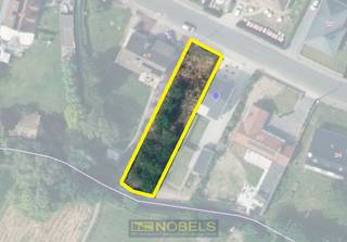 AANTREKKELIJK BOUWPERCEEL voor HALFOPEN BEBOUWING op centrale ligging in Leupegem (Oudenaarde). Met een MOOIE STRAATBREEDTE VAN 10,5 METER en...