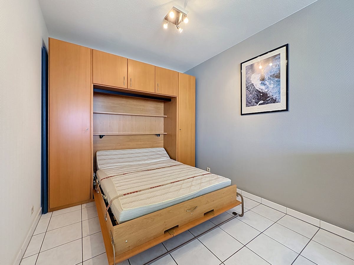 Ruim appartement met één slaapkamer en slaaphoek - foto 5