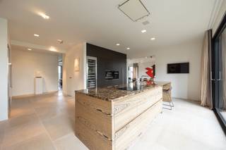 <p><span>Exclusive apartment of approx. 198 m² with spacious terrace of approx. 35 m² located in the special residential concept "The Channel".</span></p><p><span> </span></p><p><span>Layout</span></p><p><span>You enter the apartment through the entrance hall with guest toilet and checkroom, access to an office with gas fireplace and then access to a spacious and bright living room also equipped with a gas fireplace and sliding doors with access to a spacious terrace of approx 35 m². Both from the living room and the entrance hall you have access to the spacious and high quality finished kitchen with a cooking island, natural stone countertops and various appliances. Practical laundry room/utility room with connections for washer and dryer. </span></p><p><span>Through a common dressing room there is access to a master bedroom with parquet flooring, ensuite bathroom with bath, walk-in shower, toilet and double sink. Second bedroom also with ensuite bathroom.</span></p><p><span> </span></p><p><span>Details</span></p><p><span>This luxury apartment was finished with attention to detail!  Durable and high quality materials were used during the renovation/new construction in 2015. The living area is approximately 198 m², the terrace has an area of approximately 35 m². Heating by underfloor heating, central heating on natural gas. Extensive alarm system, camera surveillance, air conditioning in the master bedroom. </span></p><p><span> </span></p><p><span>Possibility to enlarge the apartment</span></p><p><span>There is a possibility to buy the adjacent apartment in order to realize a full floor to one unique apartment! This creates an apartment of approx 346m² and more than 60m² terraces!</span></p><p><span> </span></p><p><span>Parking and storage</span></p><p><span>Two car parking spaces are available in the underground parking basement. Possibility to purchase basement storage (additional cost of 14,000 euros).</span></p><p><span> </span></p><p><span>The canal</span></p><p><span>A unique living experience created by Axel Vervoordt in the former brewery and malt house on the canal near Wijnegem. Find out more about this special project on the Het Kanaal website.</span></p><p><span> </span></p><p><span>More information through our office.</span></p>