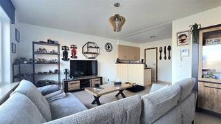 Appartement confortable de 3 chambres à coucher à Helkijn, comprenant un hall d'entrée, un espace de vie lumineux avec coin salon, s'ouvrant sur...