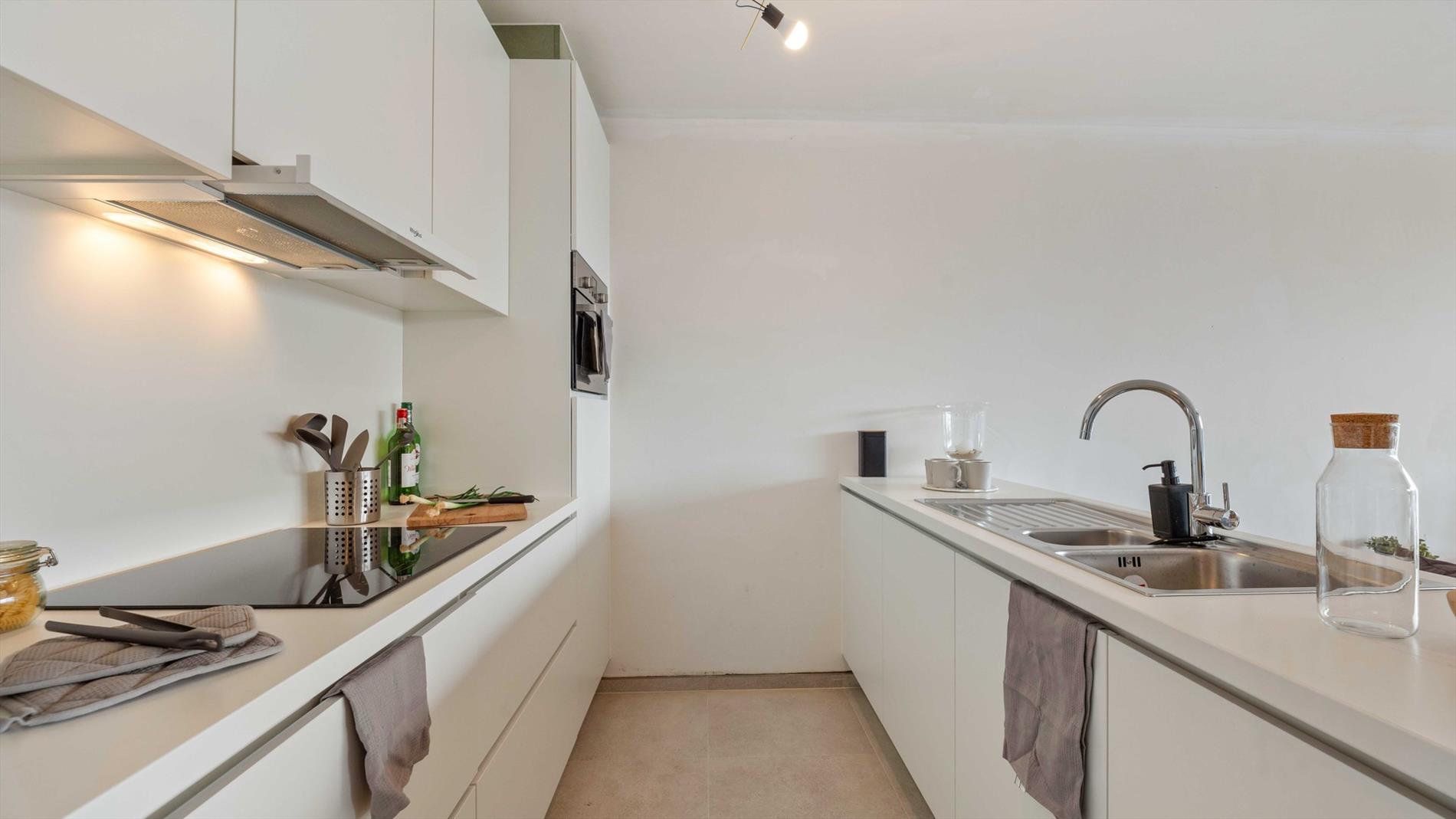 Stijlvol en energiezuinig nieuwbouwappartement met 2 slaapkamers te koop aan de rand van Veurne - foto 4