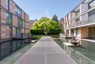 This spacious apartment combines comfort, natural light and a pleasant outdoor living space. Upon entering, you are welcomed by a generous entrance hall with a separate guest toilet.<br /><br />The bright living area forms the heart of the apartment and flows seamlessly into a fully fitted kitchen, featuring an elegant marble worktop and equipped with all the necessary appliances. The living area opens directly onto an exceptionally sunny 30 m² terrace, the perfect place to relax and enjoy outdoor living in complete tranquillity.<br /><br />The apartment features two spacious bedrooms, each with its own bathroom. The generous master bedroom is fitted with a TV lift cabinet and a well-organised walk-in dressing area. The adjoining bathroom includes a bathtub, a separate shower, a washbasin and a toilet.<br /><br />At the opposite end of the apartment, you will find the second bedroom with its own adjoining bathroom.<br /><br />For optimal comfort, the living area and one of the bedrooms are equipped with an integrated air-conditioning system. The apartment also benefits from a practical laundry room.<br /><br />A private cellar storage unit is available as an optional extra for €5,000, and a parking space can be purchased for €50,000.