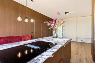 At Kruishofstraat in Wilrijk, you will find this beautiful, completely renovated apartment (100 m²). Renovated from top to bottom with only the finest materials, this property offers a rare combination of absolute luxury, privacy, and breathtaking views.<br /><br />The bright living space seamlessly transitions into the absolute eye-catcher: a high-end open kitchen, equipped with appliances and refined materials. Throughout the entire apartment, floor-to-ceiling custom built-in closets provide a sleek, minimalist, and calming interior without sacrificing storage space.<br /><br />The apartment features three bedrooms. The luxurious bathroom is meticulously finished with a lavish marble look and high-quality sanitary ware. Outdoor living is taken to a higher level here: enjoy a truly phenomenal, panoramic view of the Antwerp skyline from the terrace. Additionally, a parking space is currently being offered for sale, ideal for always having a guaranteed spot.<br /><br />In addition to aesthetic perfection, this apartment offers 100% peace of mind. It has an excellent and energy-efficient EPC label B, the electrical installation is fully compliant, and the property is demonstrably asbestos-free. A true turnkey experience where you only need to unpack your bags.<br /><br />Interested? Act fast, as this gem will not stay on the market for long.<br />Tim - 0483 60 60 60<br />tim@mondovastgoed.be