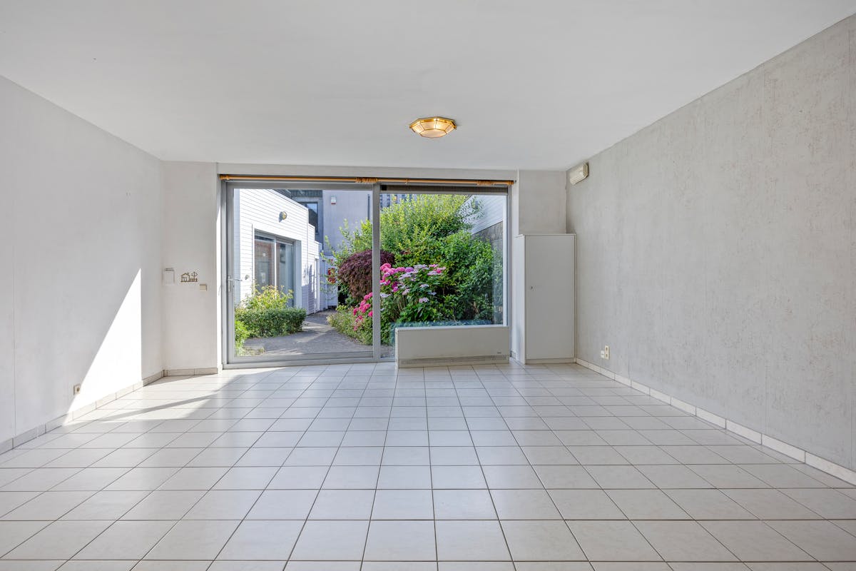 Instapklaar gelijkvloers appartement met gemeenschappelijke tuin en fietsenberging in hartje Kapellen! - foto 4