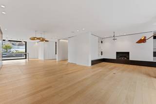 In the heart of the city, this exceptional, fully move-in ready design apartment of 222 m² (source EPC) is located on the first floor of a recent residence. This unique property combines architectural elegance, high-quality materials, advanced home automation, and exceptional living comfort.<br /><br />With an impressive sunlit terrace of approximately 40 m² at the back, you can enjoy a panoramic and unobstructed view of the surrounding greenery. At the front, there is also a second, covered terrace of approximately 12 m².<br /><br />Through the stylish entrance hall with cloakroom and guest toilet, you enter an exceptional open living space where space, light, and design harmoniously come together. The luxurious living room is equipped with exclusive Gervasoni design lighting and custom-made wall furniture.<br /><br />Next to it is a cozy sitting area with a library and gas fireplace, as well as an elegant dining area with custom-made cabinets. A separate multifunctional space offers numerous possibilities as a TV room, office, hobby room, or extra bedroom.<br /><br />The high-quality custom kitchen is the heart of the apartment and is finished with an exclusive Dekton countertop and equipped with premium appliances. The refined Bocci design lighting emphasizes the luxurious character of this living kitchen.<br /><br />The architectural corridor, designed as an elegant gallery overlooking the rear terrace, leads to the private sleeping area. Here you will find:<br /><br />a spacious master suite with built-in custom closets;<br />a second bedroom with ensuite bathroom;<br />an exclusive wellness bathroom equipped with a freestanding bath, double sink, walk-in shower, and infrared sunshower;<br />a separate, fully furnished dressing room.<br /><br />State-of-the-art comfort and security<br /><br />This apartment is equipped with an extensive home automation system (Qbus) which controls functions such as:<br />lighting;<br />air conditioning;<br />underfloor heating;<br />shutters;<br />secure access control;<br />automatic security door;<br />remote control of various functions.<br /><br />In addition, the luxury apartment features:<br /><br />a separate alarm system;<br />integrated audio system;<br />indoor and outdoor routers;<br />custom-made curtains;<br />exclusive design lighting from Kreon, Gervasoni, and Bocci.<br /><br />Energy-efficient and future-proof<br /><br />Thanks to an excellent energy performance with an A-rated EPC label (61 kWh/m²), this exclusive property combines luxurious living with contemporary energy comfort.<br /><br />Optional<br /><br />A closed garage box with an automatic gate (and electrical provision) for two cars can be optionally purchased for a price of 70000EUR.