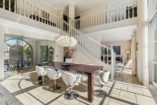 This beautiful villa with an "open space" concept in Kapellen is a dream home for anyone looking for luxury and comfort.<br /><br />Built in 2002, the property is located on a spacious plot of 2060 square meters and has a living area of 297 square meters.<br />We drive through the automatic gate onto the property and easily park our car in the designated parking spaces or in the double garage.<br /><br />Upon entering the villa, we are bathed in light thanks to the surprising "open space" concept, which is very characteristic of this exceptional villa.<br /><br />From the entrance hall, we have a connection to the living and dining area and a beautiful connection to the garden.<br /><br />We take the glass door to the living area and notice the unfolding high open void, creating a very spacious feeling.<br />The living area with fireplace seamlessly flows into the living-dining kitchen.<br />This is equipped with the necessary appliances, a kitchen island, and a breakfast nook with a view of the garden.<br />A utility room/laundry room and a double garage provide the necessary living comfort in the home.<br /><br />Furthermore, there is a master bedroom on this ground floor with a built-in wardrobe and an en-suite full bathroom with shower, bath, and sink with cabinets.<br /><br />We take the open staircase from the living room to the first floor.<br /><br />The landing connects the four bedrooms and the open office space with a view of the garden.<br /><br />There is a separate bathroom on the landing and a bathroom that is en-suite to one of the 4 bedrooms.<br /><br />Outside, there is a beautifully landscaped garden with a sunny southwest-facing terrace, where you can enjoy the sun.<br /><br />In addition, there is a spacious garage with space for 2 cars and ample parking on the property.<br /><br />In short, this villa in Kapellen is an ideal place to live for those seeking comfort, luxury, and space.<br />With all the amenities you need and a beautiful environment, this is a dream home that meets all your desires.<br /><br />Extraordinary features<br />- quiet environment<br />- 5 bedrooms: master/guest room on the ground floor and 4 bedrooms on the first floor<br />- all comfort<br />- well-maintained<br />- accessibility to public transport, shops, schools<br />- ready to move in<br /><br />EPC = 197 kWh/m² - Vg - Wg - Gmo - Gvkr - Gvv