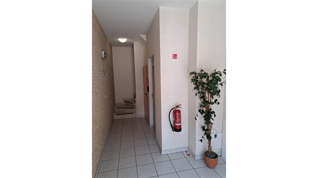 Een centraal gelegen opbrengsteigendom bestaande uit 5 appartementen, handelsgelijkvloers en 5 garages - foto 4