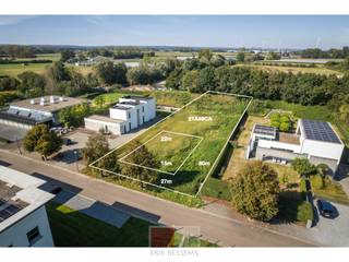 Exclusieve bouwgrond met een riante breedte van 27 m, met een oppervlakte van 2.149 m2 in het charmante Oud-Rekem – slechts enkele minuten van Maastricht!<br /><br />Bekijk de video via volgende link: https://youtu.be/dTbmNHRvgjE<br /><br />Droomt u van wonen in een prachtig groen dorp en tegelijkertijd dicht bij de levendige stad Maastricht? Dan is dit uw kans! Oud-Rekem, uitgeroepen tot 'Het mooiste dorp van Vlaanderen', biedt de ideale mix van rust, natuur en cultuur. De idyllische dorpskern met historische gebouwen, gezellige terrasjes en het indrukwekkende kasteel d'Aspremont-Lynden, brengt u terug naar vervlogen tijden.<br /><br />Dit exclusieve perceel ligt op slechts enkele minuten van Maastricht, één van de meest dynamische steden in de regio. U geniet hier van het beste van twee werelden: de rust en ruimte van een charmant Belgisch dorp en de nabijheid van het bruisende stadsleven van Maastricht, waar u volop kunt genieten van winkels, restaurants, cultuur en uitgaansgelegenheden. Dankzij de uitstekende ligging bent u bovendien snel in steden als Hasselt, Luik, Eindhoven en Aken.<br /><br />Dit ruime perceel biedt de mogelijkheid om een luxe vrijstaande villa te bouwen met twee woonlagen, kelder of garage én een zwembad. U bepaalt zelf hoe en wanneer u bouwt, zonder bouwverplichting, en heeft de optie om samen te werken met de exclusieve villabouwer Vlassak-Verhulst voor een uniek ontwerp.<br /><br />Waarom kiezen voor dit perceel?<br />- Groot perceel van ruim 2.000 m² voor een exclusieve villa.<br />- Unieke ligging: rust en natuur in Oud-Rekem, met Maastricht op slechts een steenworp afstand.<br />- Perfecte bereikbaarheid: snel in het centrum van Maastricht én goede verbindingen naar andere grote steden.<br />- Realisatie zwembad mogelijk.<br />- Geen bouwverplichting: bouw wanneer het u uitkomt.<br /><br />Verkavelingsvoorschriften<br />- Bestemming: hoofdbestemming wonen, minimaal 50% van het perceel dient voor woonbestemming.<br />- Nevenbestemming: tot 50% van het perceel kan gebruikt worden voor diensten, kantoren of vrije beroepen.<br />- Bouwvorm: open bebouwing, maximale bouwdiepte 22 meter en breedte 15 meter.<br />- Maximale bouwhoogte: 2 bouwlagen.<br />- Bouwlijn: 13 meter van de as van de straat.<br /><br />Informatie stedenbouwkundige voorschriften:<br />STEDENBOUWKUNDIGE VERGUNNING: nee<br />MEEST RECENTE BESTEMMING: gebieden voor gemeenschapsvoorzieningen en openbaar nut<br />DAGVAARDINGEN UITGEBRACHT: nee<br />VOORKOOPRECHT OP DIT GOED: nee<br />VERKAVELINGSVERGUNNING: ja<br />WATERGEVOELIG OPENRUIMTEGEBIED: nee<br /><br />Overstromingsgevoelige gebieden:<br />Perceelscore of P-score: A<br />Gebouwenscore of G-score: ONBEKEND<br />Ligging in Signaalgebied: nee<br />Ligging in afgebakende oeverzone of afgebakend overstromingsgebied: nee<br /><br />A: geen overstroming gemodelleerd B: kleine kans op overstromingen onder klimaatverandering C: kleine kans op overstromingen D: middelgrote kans op overstromingen<br /><br />Beschermd erfgoed<br />GEÏNVENTARISEERD ERFGOED: nee<br />BESCHERMD ONROEREND ERFGOED: Oude Kern Rekem (bouwkundig / landschappelijk), gebied 1629<br /><br />Extra Informatie De gemeenschappelijke park- en omgevingskosten bedragen ca. €250 per jaar. Dit omvat onder andere het onderhoud van het domein, erfgoedpremies en verzekering.<br /><br />Interesse? Wij nodigen u uit voor een kop koffie met vlaai om de mogelijkheden verder te bespreken op kantoor, bij u thuis of op 1 van de gezellige terrassen van Oud-Rekem. Dit is uw kans om een droomwoning te realiseren in een unieke omgeving, vlak bij Maastricht!<br />Exclusive Building Plot of 2,149 m² in Picturesque Oud-Rekem – Just Minutes from Maastricht!<br /><br />Are you dreaming of living in a charming green village while staying close to the vibrant city of Maastricht? This is your opportunity! Situated in Oud-Rekem, named “The Most Beautiful Village in Flanders,” this location offers the perfect blend of tranquility, nature, and culture. Its picturesque village center, complete with historic buildings, inviting terraces, and the impressive d'Aspremont-Lynden Castle, takes you back in time.<br /><br />This exclusive plot is just minutes away from Maastricht, one of the most dynamic cities in the region. Here, you can enjoy the best of both worlds: the peace and space of a delightful Belgian village and the lively city life of Maastricht, with its extensive shopping, dining, cultural, and entertainment options. Thanks to its prime location, you’ll also have quick access to cities like Hasselt, Liège, Eindhoven, and Aachen.<br /><br />This generous plot offers the opportunity to build a luxurious detached villa with two floors, a basement or garage, and even a swimming pool. You have full control over how and when you build, as there is no construction obligation. You may also collaborate with the exclusive villa builder Vlassak-Verhulst for a unique design.<br /><br />Why Choose This Plot?<br /><br />Spacious plot: Over 2,000 m² for an exclusive villa.<br />Unique location: Enjoy the tranquility of Oud-Rekem with Maastricht just a stone’s throw away.<br />Excellent accessibility: Quickly reach the center of Maastricht and enjoy easy connections to major cities.<br />Swimming pool potential: Design a home with luxurious features.<br />No construction obligation: Build at your convenience.<br />Zoning and Building Regulations<br /><br />Primary purpose: At least 50% of the plot must be residential.<br />Secondary purpose: Up to 50% may be used for services, offices, or professional purposes.<br />Building type: Open construction, with a maximum building depth of 22 meters and width of 15 meters.<br />Maximum height: Two floors.<br />Building line: 13 meters from the street axis.<br />Plot width: 27 meters, ensuring exceptional privacy.<br />Urban Planning Information<br /><br />Urban planning permit: No.<br />Most recent zoning: Community facilities and public utility areas.<br />Legal notices issued: No.<br />Preemptive purchase right: No.<br />Subdivision permit: Yes.<br />Water-sensitive open space area: No.<br />Flood Risk Information<br /><br />Plot score (P-score): A.<br />Building score (G-score): Unknown.<br />Located in signal area: No.<br />Located in designated riverbank or flood area: No.<br />Flood risk categories:<br /><br />A: No flooding modeled.<br />B: Low risk under climate change scenarios.<br />C: Small risk of flooding.<br />D: Moderate risk of flooding.<br />Heritage Protection<br /><br />Inventoried heritage: No.<br />Protected heritage: Yes, "Oude Kern Rekem" (architectural/landscape), Area 1629.<br />Additional Information<br /><br />The shared park and environment maintenance costs are approximately €250 per year, covering domain maintenance, heritage subsidies, and insurance.<br /><br />Interested?<br /><br />We invite you to discuss the possibilities over coffee and traditional Limburg pie at our office, your home, or one of Oud-Rekem’s delightful terraces. This is your chance to create your dream home in a unique setting, just moments away from Maastricht!