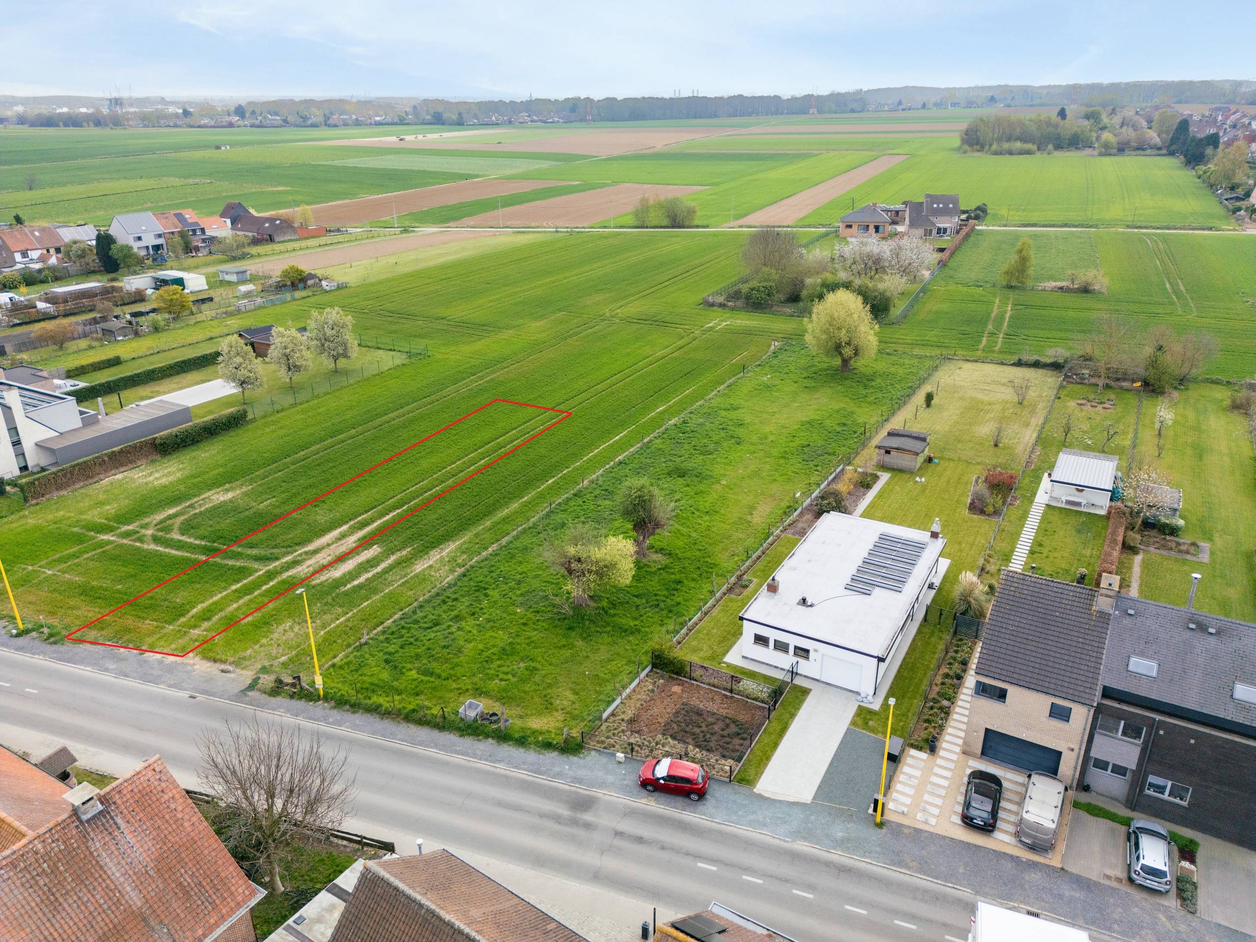 Zuidgerichte bouwgrond tussen velden te koop in Grimbergen - foto 1