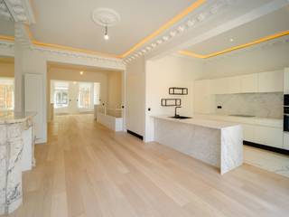 Located between Avenue Louise and Place Fernand Cocq, on a quiet street near Place Stéphanie, this new duplex apartment is on the ground floor of a bourgeois house divided into three apartments and completely renovated. This 2-bedroom apartment of approximately 155 m² benefits from beautiful terraces of approximately 45 m² and a large garden of approximately 150 m².<br /><br />The ground floor comprises spacious reception rooms with high molded ceilings and elegant marble fireplaces, opening onto the dining room and the fully equipped open-plan kitchen, bathed in light, providing access to the terrace and garden. The private staircase leads to the lower level, which offers a master suite with a dressing room and a full bathroom with toilet, a second en-suite bedroom with a private shower room, a toilet, and a laundry room.<br /><br />Other: PEB B-, reinforced door, new and efficient systems and insulation (gas condensing boiler and individual dual-flow ventilation), quality materials and finishes (oak parquet flooring, recessed LED lighting, closets, etc.). Sale subject to 12.5% registration fee.<br />Some images are furnished by AI. <br /><br />Place Stéphanie is located near the center of Brussels, between Avenue Louise and Place Poelaert. Home to numerous shops and stores, it is ideally served by public transportation.<br /><br />For further information, please contact Philippe Dijkmans at +32 (0) 475 45 77 20.