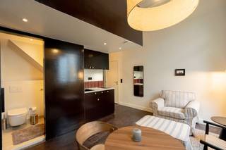 <p><span>Stijlvolle studio in co-living concept in hartje Antwerpen </span></p><p><span> </span></p><p><span>Deze studio (tweede verdieping) maakt deel uit van "Old Brick", een prachtig gerenoveerd gebouw van meer dan 600 m², gelegen aan de Oudesteenweg 108 in een rustige buurt, vlakbij winkels, openbaar vervoer en het Centraal Station van Antwerpen.</span></p><p><span> </span></p><p><span>De studio beschikt over een eigen bed, badkamer met douche en toilet en kitchenette, wat zorgt voor comfort en privacy. </span></p><p><span>Daarnaast hebben bewoners toegang tot kwalitatieve gemeenschappelijke ruimtes, waaronder een volledig uitgeruste keuken, ruime leefruimte, eetplaats, werkplekken en een gezellige lounge, ontworpen om verbinding en welzijn te stimuleren. </span></p><p><span> </span></p><p><span>Old Brick huisvest een dynamische community van voornamelijk internationale expats en young professionals die waarde hechten aan comfort, design en samenleven. </span></p><p><span> </span></p><p><span>Bijzonderheden:</span><span> </span></p><p><span>- De huurprijs is inclusief elektriciteit, water, gas, internet, wekelijkse cleaning van de gemeenschappelijke ruimtes, meubilair, Netflix en community events. </span></p><p><span>- Beschikbaar vanaf 1 juli 2026</span></p><p><span> </span></p><p><span>De foto's vanaf de draaitrap zijn van de gemeenschappelijke delen. </span></p><p><span> </span></p><p><span>Ben jij geïnteresseerd in gemeubelde kamers te huur in Antwerpen centrum, ben je op zoek naar ander vastgoed of wens je de waarde van jouw eigendom te kennen? Dan ben je bij BOLT Immo aan het juiste adres! Wij helpen jou graag verder.</span></p><p><span> </span></p><p><span>__________________________________________________________________________</span></p><p><span> </span></p><p><span>Stylish private studio in a co-living concept in the heart of Antwerp</span></p><p><span> </span></p><p><span>This studio (2nd floor) is part of “Old Brick” a beautifully renovated building of over 600 m², located at Oudesteenweg 108 in a quiet neighborhood, close to shops, public transport, and Antwerp Central Station.</span></p><p><span> </span></p><p><span>The studio features a private bed, bathroom with shower and toilet, and kitchenette, ensuring comfort and privacy.</span></p><p><span>In addition, residents have access to high-quality shared spaces, including a fully equipped kitchen, spacious living area, dining space, workspaces, and a cozy lounge, all designed to foster connection and well-being.</span></p><p><span> </span></p><p><span>Old Brick is home to a dynamic community of mainly international expats and young professionals who value comfort, design, and community living.</span></p><p><span> </span></p><p><span>Key features:</span></p><ul><li><span>The rental price includes electricity, water, gas, internet, weekly cleaning of the common areas, furniture, Netflix, and community events </span></li><li><span>Available from July 1st</span></li></ul><p><span> </span></p><p><span>The photos from the spiral staircase onwards show the common areas. </span></p><p><span> </span></p><p><span>Are you interested in this studio for rent in Antwerp, are you looking for other real estate or would you like to know the value of your property? Then you have come to the right place at BOLT Immo! We will gladly help you.</span></p><p><span> </span></p><p><span> </span></p><p><span> </span></p><p><span> </span></p><p><span> </span></p><p><span> </span></p>