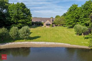 Prachtige eigendom met bos, prachtige tuin, vijver en ruim landhuis bestaande uit inkomhal, bureel, zeer ruime living met open haard,...