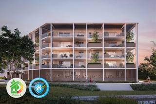 <p><strong>Rustig wonen, met uitzicht op een groen en autoluw park met waterpartij: Dat is nieuwbouwproject TAMBOER, gelegen aan Kasteelloop, een gloednieuw binnengebied aan de rand van de stad, net binnen de ring. Het park vormt een groene schakel met een aangename fiets- en wandelroute tussen het Stadspark en het centrum. Dat betekent rustig wonen in hartje Turnhout, en toch op een steenworp van de Grote Markt, alle voorzieningen, scholen, winkels, openbaar vervoer, het Stadspark en met een gunstige verbinding naar de E34 Antwerpen-Eindhoven. Tamboer trekt volop de kaart van duurzaamheid: De appartementen zijn “bijna-energieneutraal” (BEN) en maken gebruik van groene energiebronnen. </strong><br /><br />Een nieuwbouwproject met kwaliteitsvolle materialen, een persoonlijke begeleiding en een afwerking naar wens. De appartementen zijn dankzij het<strong> A-label “bijna-energieneutraal” (BEN)</strong> en gericht op de toekomst. Tamboer is een ecologisch verantwoord, duurzaam en energiezuinig woonproject: Slimme ventilatietechnieken, uitstekende (akoestische) isolatie, energievriendelijke vloerverwarming, regenwater recuperatie, doordachte materiaalkeuze, groene gevels die zorgen voor verkoeling, ... U bent er dus van verzekerd dat uw appartement moeiteloos voldoet aan steeds maar strengere normen. Uw verbruik wordt zo laag mogelijk gehouden, en dat voelt u in uw portemonnee. <br /><br />Het zijn stuk voor stuk ruimtelijke appartementen met een praktische indeling en <strong>veel lichtinval </strong>dankzij de grote raampartijen en de juiste oriëntatie. Verder beschikt ieder appartement over een ruim en zongericht terras met een minimumdiepte van 2m80. Dit zijn<strong> echte "leefterrassen"</strong>, waar u heerlijk kan vertoeven met zicht op het <strong>omliggende groen</strong>. Elk appartement wordt tot in de puntjes afgewerkt, volledig naar uw smaak. Dit zorgt voor een ideale woonomgeving, voor uzelf, of als <strong>investering</strong>. <br /><br />De wagen kan u kwijt in de ondergrondse parkeergarage – een bewuste keuze om bovengronds meer ruimte te laten voor groen. Voor uw fiets(en) is een <strong>grote, afgesloten fietsenstalling</strong> voorzien en andere spullen bergt u probleemloos in uw private kelderberging. <br /><br />Er zijn verschillende appartementen, met keuze uit <strong>2 of 3 slaapkamers en riante (hoek)terrassen.</strong> Oppervlaktes beginnen vanaf 69m² en gaan tot 133m², telkens exclusief de ruime terrassen tot maar liefst 61m². <strong>Prijzen starten vanaf € 227.900,</strong> exclusief aankoopkosten. Een aantal appartementen zijn uitermate geschikt als investering. Kortom, voor ieder wat wils! Wij bekijken met veel plezier wat er voor u in aanmerking kan komen.</p>
<p><strong>Wie is de projectontwikkelaar?</strong> DC Belgium is al decennia een toonaangevende ontwikkelaar in heel het land. Zij behoren tot de topvan de Belgische vastgoedontwikkelaars en staan voor betaalbare kwaliteit, een gevarieerd woonaanbod en veel aandacht voor groen. Deze jarenlange ervaring garandeert gemoedsrust: U bent verzekerd van een persoonlijke begeleiding doorheen het volledige aankoopproces en een afwerking tot in de puntjes, naar uw smaak en budget. <strong>Bovendien geniet u van een 100% voltooiingsgarantie dankzij de Wet Breyne. </strong></p>