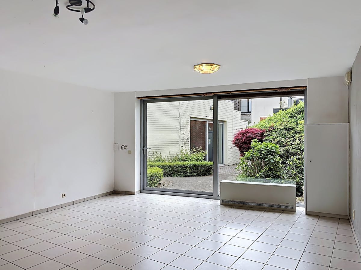 Instapklaar gelijkvloers appartement met gemeenschappelijke tuin en fietsenberging in hartje Kapellen! - foto 4