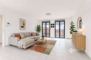 <p><span>Spacious apartment (110 m²) with 2 bedrooms and terrace (12 m²) in Antwerp (2020).</span></p><p><span>Living opposite Den Tir Shopping Center means enjoying stores, restaurants and numerous amenities nearby, combined with excellent accessibility. Thanks to the proximity of public transport, the velo-sharing system and important connecting roads, you can effortlessly move here to and around the city.</span></p><p><span>The apartment is located on the second floor of a well-kept building built in 2012, whose roof was insulated conformably. The fixed costs are approximately €140/month. Furthermore, the electricity is compliant and the aluminum windows are double-glazed.</span></p><p><span>With a living area of no less than 110 m², you will enjoy a particularly large amount of space and light here. Upon entering, there is a practical checkroom corner, as well as a separate toilet and a handy storage/laundry room (3 m²).</span></p><p><span>The bright living space with open, fully equipped kitchen forms the heart of the apartment and has a total area of about 50 m². Thanks to the large windows at the front and rear, you enjoy a pleasant open feeling and lots of natural light here. Through a sliding door you reach the southeast-oriented terrace of 12 m², where you can enjoy an open view of the surroundings.</span></p><p><span>Furthermore, the apartment has two full bedrooms of 10 m² and 15 m² and a bathroom of 7 m² with walk-in shower and washbasin cabinet.</span></p><p><span>Are you looking for a spacious and move-in ready apartment in a central location? Do not miss this opportunity! Living area 110 m² – ref: gross floor pop. For more info or a free estimate visit </span><span><span>www.hansimmo.be</span></span></p><p><span> </span></p>