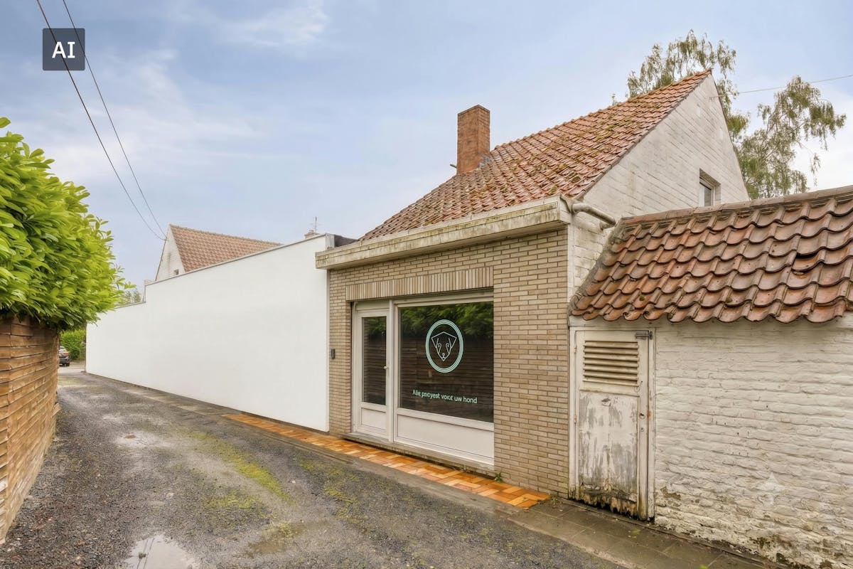 Te renoveren woning met grote tuin en bijgebouw te Heule - foto 4