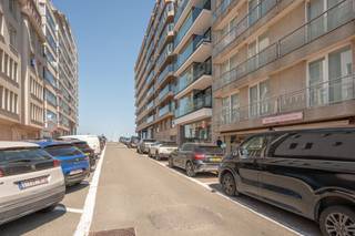 Ideally located in the vibrant centre of Knokke, just a short stroll from the seafront, sandy beach and exclusive boutiques, this beautifully renovated apartment perfectly combines elegance, comfort and an exceptional location.
Upon entering, the welcoming entrance hall features a cloakroom, guest toilet and a practical laundry room. The bright living and dining area enjoys pleasant partial sea views and has been finished with bespoke built-in cabinetry and a stylish bar unit. The open-plan travertine kitchen is fully equipped with premium Miele appliances, including a wine cooler. The apartment offers three comfortable bedrooms. The spacious master bedroom features built-in wardrobes and a luxurious en-suite bathroom with a shower, washbasin and toilet. The second bedroom also benefits from built-in wardrobes and is served by a separate shower room. The third bedroom is currently fitted with bunk beds and a desk but can easily accommodate a double bed if desired. Each bedroom opens directly onto the sunny rear terrace of approximately 36 m², providing a wonderful outdoor space to relax in complete privacy. All bedrooms are fitted with electric shutters. Residents also benefit from the presence of a concierge and a communal bicycle storage room.
Looking for a move-in-ready apartment in one of Knokke's most sought-after locations? Contact Alex Dewulf for more information or to arrange a private viewing.