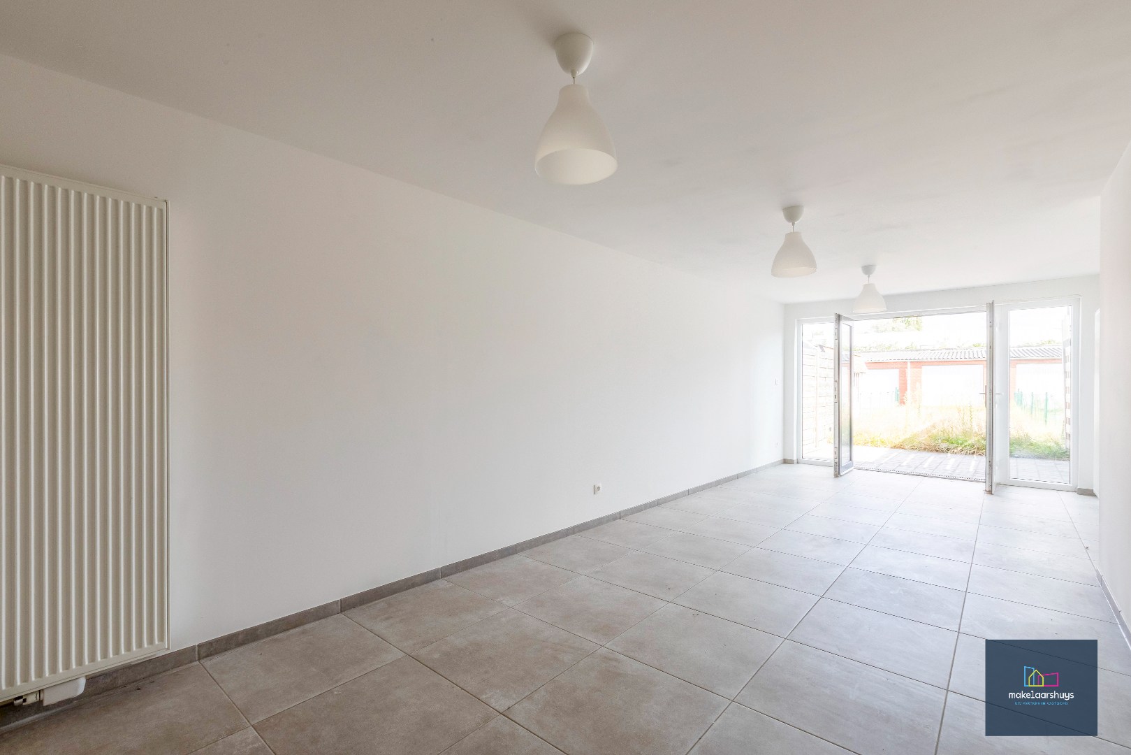 Instapklare gerenoveerde woning in rij met terras, tuin en garagebox - foto 5