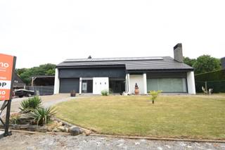 Your Dream Home: Space, Comfort and Homeliness in Koersel-Beringen! NEW AT ANIMOVASTGOED!!! Welcome home to this charming country house on an impressive plot of 20a86 in Koersel-Beringen! If you dream of a spacious home full of warmth, comfort and functionality, perfect for both your family life and professional ambitions, then look no further. This solidly built house from 1975 exudes tranquility and offers a wealth of possibilities. The house has a full basement, which guarantees plenty of storage space and extra ease of use. Once inside through the inviting entrance hall, you are led to the bright living space that flows seamlessly into the cozy dining area. The place for family moments! The separate kitchen was modernized in 2015 and is a real treat for every home chef. The night hall gives access to no fewer than four comfortable bedrooms, one of which can be ideally used as a practice room or home office, with the necessary privacy. In addition, the house has a bathroom with bath, a separate toilet and a handy storage/laundry room, complete with an extra shower. Outside you can fully enjoy the peace and space. The garage with sectional door and the carport offer ample parking. The veranda and the covered terrace are perfect places to relax, while you look out over the extensive, green garden, a paradise for relaxation and outdoor activities. The attic space is accessible via an access hatch in the garage, which now serves as storage, but with potential for additional living space after finishing. This house is also equipped with modern facilities for comfort and energy efficiency: five air conditioning units will be installed in 2023 (including in the living room and all bedrooms) for a pleasant climate all year round. With 17 solar panels and a digital meter, you contribute to a sustainable future, and some windows were fitted with triple glazing in 2019 for optimal insulation. In short, this is the ideal family home: spacious, well-maintained, with the unique opportunity for a home practice, and strategically located near all amenities. A house that you will immediately fall in love with! Interested? Contact us for a viewing and be surprised by the warm atmosphere and versatility of this special property!