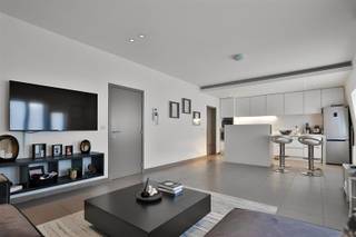 On the border of Edegem and Mortsel, we offer you this spacious and renovated flat (100m²) with 2 bedrooms. Included in the price is a...