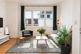 <p><span>This charming, move-in-ready apartment is located on a quiet, recently landscaped street in the popular Oud-Berchem neighborhood. Here, you’ll enjoy a particularly central location, within walking distance of cozy cafes, restaurants, local shops, and the Groen Kwartier. Antwerp-Berchem Station, various public transportation connections, downtown Antwerp, and the Ring are also easily accessible.</span></p><p><span>The apartment was renovated in 2021 and features a net living area of approximately 52 m². Although the space is compact, the exceptional ceiling height of approximately 3.05 meters, the large windows, and the abundant natural light create a particularly open and spacious feel. The authentic hardwood floors also add warmth and character to the space.</span></p><p><span>The cozy living area is a pleasant place to relax and opens onto the functionally designed open kitchen. The kitchen is equipped with a refrigerator, an electric stovetop, and a range hood. The spacious bedroom offers enough room for a full-size bed and additional closets.</span></p><p><span>The renovated bathroom features a comfortable walk-in shower, a sink, and natural daylight. There is also a separate guest restroom. Thanks to the two separate entrances to the apartment, there are also interesting possibilities for further optimizing the layout and flow to suit your preferences.</span></p><p><span>Storage space has also been taken into account. The apartment includes a private basement storage unit with an area of approximately 2 m². Ideal for storing seasonal items, groceries, or other necessities. In the shared indoor bicycle storage area, you also have two private bike hooks.</span></p><p><span>The apartment also offers a great deal of peace of mind from a technical standpoint. The flat roof has already been renovated and insulated with PUR/PIR insulation. In addition, there are three solar panels with a total installed capacity of 1,500 Wp. The individual Junkers condensing gas boiler provides heating and domestic hot water.</span></p><p><span>The windows feature PVC frames and high-efficiency glazing. Separate digital meters for gas, water, and electricity allow you to clearly track your personal usage. The electrical system is certified until March 21, 2046, and according to the available asbestos certificate, the apartment is completely asbestos-free.</span></p><p><span>The apartment has an EPC rating of D with an energy score of 337 kWh/m². Thanks to the insulated roof, high-efficiency glazing, condensing boiler, and solar panels, several significant energy-efficiency improvements have already been implemented.</span></p><p><span>The apartment is located on the third floor of a small building without an elevator. This contributes to the low common area fees of approximately €75 per month, including the property manager. The apartment is available immediately and can be purchased fully furnished and with accessories, if desired.</span></p><p><span>Key features:</span></p><ul><li><p><span>Sought-after location in the popular Oud-Berchem neighborhood</span></p></li><li><p><span>Quiet street that has recently been landscaped</span></p></li><li><p><span>Within walking distance of the Groen Kwartier, restaurants, and shops</span></p></li><li><p><span>Antwerp-Berchem station and public transportation nearby</span></p></li><li><p><span>Easy access to downtown and the Antwerp Ring Road</span></p></li><li><p><span>Move-in-ready apartment, renovated in 2021</span></p></li><li><p><span>Approximately 52 m² of net living space</span></p></li><li><p><span>One spacious bedroom</span></p></li><li><p><span>High ceilings measuring 3.10 meters</span></p></li><li><p><span>Large windows and an abundance of natural light</span></p></li><li><p><span>Authentic hardwood floors</span></p></li><li><p><span>Functionally designed open kitchen</span></p></li><li><p><span>Renovated bathroom with walk-in shower and natural light</span></p></li><li><p><span>Separate guest restroom</span></p></li><li><p><span>Two entrances with potential for a customized layout</span></p></li><li><p><span>2 separate private basement storage rooms</span></p></li><li><p><span>Indoor bicycle storage with two private bike hooks</span></p></li><li><p><span>Renovated and insulated flat roof</span></p></li><li><p><span>Three solar panels with a capacity of 1,500 Wp</span></p></li><li><p><span>Individual condensing gas boiler</span></p></li><li><p><span>High-efficiency glazing</span></p></li><li><p><span>Separate digital meters</span></p></li><li><p><span>Electrical system compliant through 2046</span></p></li><li><p><span>Asbestos-free</span></p></li><li><p><span>EPC rating D – 337 kWh/m²</span></p></li><li><p><span>Limited common area fees of approximately €75 per month</span></p></li><li><p><span>Option to purchase all furnishings and accessories</span></p></li><li><p><span> Attractive for investors: Gross return of 5.50%</span></p></li><li><p><span>Available immediately</span></p></li></ul><p><span>Thanks to its combination of a sought-after location, plenty of natural light, high ceilings, and low fixed costs, this apartment presents a particularly attractive opportunity for singles, couples, and first-time buyers. It also offers interesting possibilities as a city retreat, an apartment for college-aged children, or a real estate investment.</span></p><p><span>Interested? Choose your time slot and schedule your own visit on September 28 and 29 to discover for yourself the unique character of this light-filled penthouse. Sealed-bid offers only. Submit your offer by October 2, 2026. Contact us for more information at </span><span>info@immoley.be</span><span> or call 03/535 20 00</span></p>