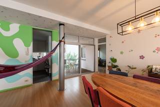 Located on Ambtmanstraat, in a central location within walking distance of shops, restaurants, and public transport, this two-bedroom apartment is a true hidden gem in the heart of the city.<br /><br />Upon entering, you are immediately welcomed by the spacious and light-filled living area. The open-plan living room, featuring wooden flooring, seamlessly combines the lounge and dining areas, creating a warm and inviting atmosphere.<br /><br />Adjoining the living space is a charming terrace overlooking a peaceful green oasis in the middle of the city, the perfect spot to enjoy breakfast in the morning or unwind in the evening.<br /><br />The apartment offers two spacious bedrooms, both finished with wooden flooring. The bathroom features a double washbasin, a bathtub with handheld shower, and a separate toilet.<br /><br />The functional kitchen is fully equipped, while a separate utility room provides additional convenience with space for a washing machine and tumble dryer.<br /><br />An ideal property for anyone looking to enjoy city living in a prime central location in Antwerp.