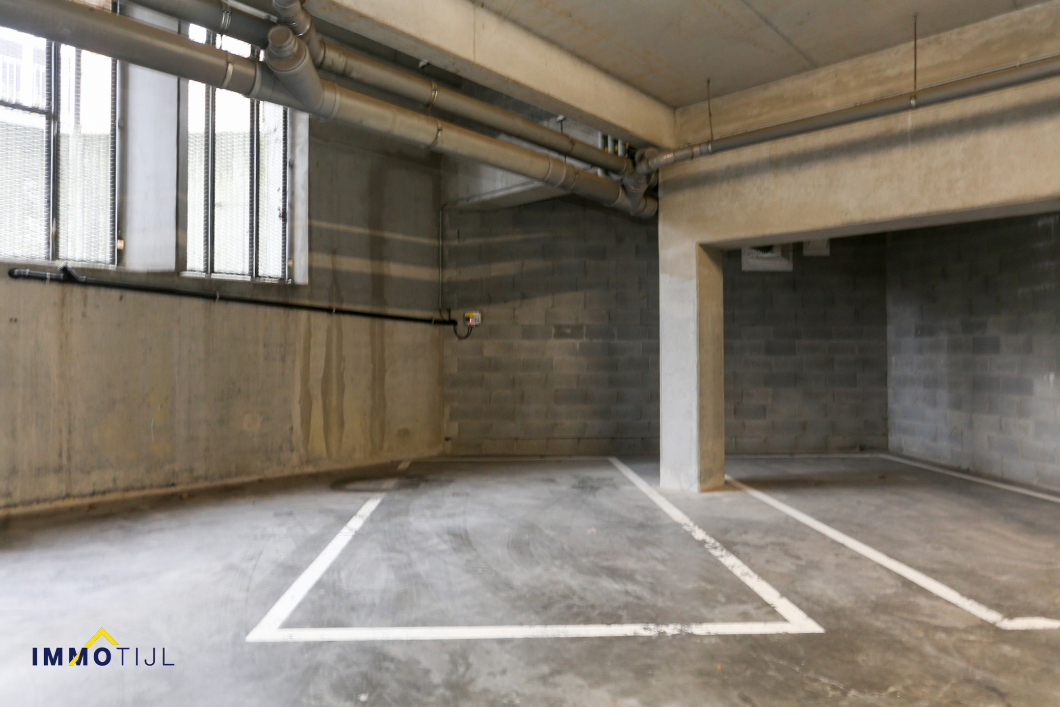 Ruime ondergrondse autostaanplaats centrum Opwijk! - foto 3