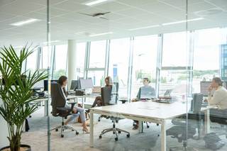 These furnished full-service offices for rent are located in the MeetDistrict business center. As part of the Planet Group Arena in Ghent, it enjoys a strategic location near the R4, E40 and E17 and within cycling distance of Ghent Sint-Pieters station. Partly due to the strong focus on sustainability, the contemporary design and the wide range of facilities (including meeting rooms and event spaces, PitchArena, auditorium, etc.), this business center is the ideal place for start-ups, scale-ups and freelancers. For example, there is also a strong focus on expanding a network.There is also the option to rent flex desks.Amenities:- Underground and aboveground parking- 24/7 access- Shared kitchen- Showers - Sanitary- Cleaning service- Dining options in the building and within walking distance- Elevator - Air conditioning - Large and small meeting rooms- Quiet areas- Auditorium- Event floor- Flexspace- MembershipRental prices include costs (maintenance of common and private areas, reception, 24/7 access, showers, furniture, electricity consumption, water and heating, meeting rooms, property tax, etc.). Are you interested in these offices for rent in Ghent? Don't hesitate and contact us at 09 245 35 35 or business.gent@dewaele.com.