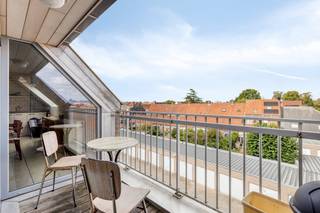 Looking for a centrally located penthouse for sale in Roeselare? Then this pleasant and bright corner apartment in the Prinsenhof residence is definitely something for you. This apartment is located in a strategic location in Roeselare, near the station and within walking distance of shops, schools and restaurants. Ideal for those who want to live centrally or are looking for an interesting real estate investment.<br /><br />Layout of the attic apartment for sale:<br /><br />entrance hall with separate guest toilet | spacious, bright living room with adjoining terrace | open kitchen | storage | bathroom with bath and double washbasin | two bedrooms<br /><br />Advantages of this apartment for sale in Roeselare:<br /><br />- centrally located, within walking distance of Roeselare station<br />- ready to move in and well maintained<br />- favourable EPC and blank electrical inspection<br />- bright roof apartment with pleasant terrace<br /><br />Possibility to purchase a garage box (25,000 euro) on the domain.<br /><br />This apartment for sale in Roeselare is suitable for private use or as an investment. Whether you're a starter, commuter, or investor, you should definitely come and see this apartment. Moreover, as a city, Roeselare offers an excellent combination of living, shopping and relaxing in the center of West Flanders.<br /><br />Register of measures: no