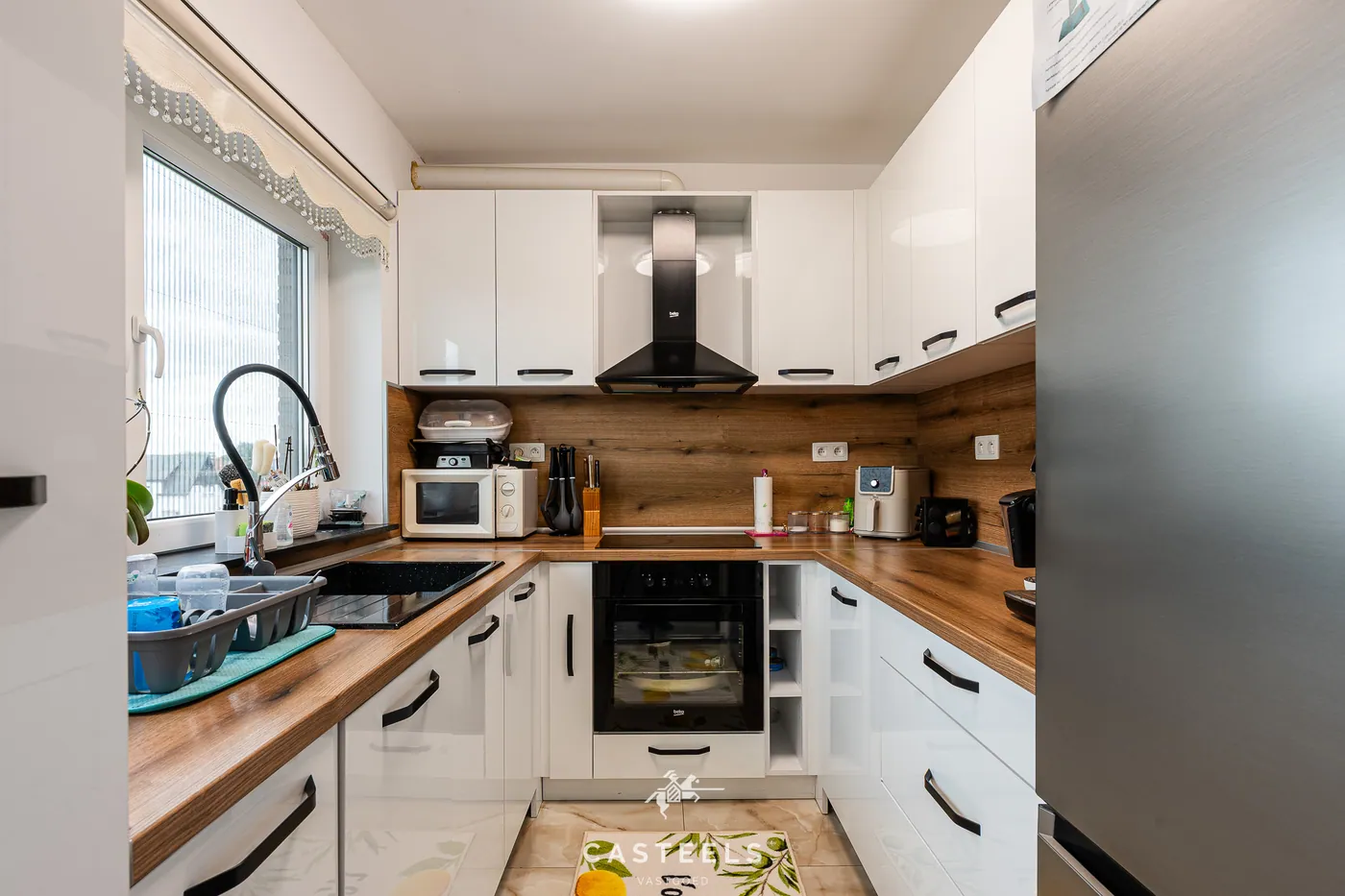 Gerenoveerd duplexappartement met groot terras, garage en 2 slaapkamers in Zelzate - foto 4