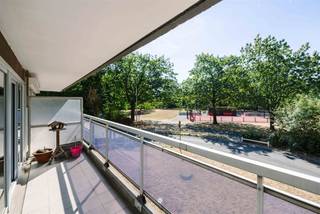 <h2><span>Sint-Niklaas - Bright corner apartment with a view of greenery and two spacious terraces</span></h2><p><span>Looking for a spacious apartment in a green and sought-after location in Sint-Niklaas? This well-maintained corner apartment, located in Block 5—the newest residence in the Queen Fabiola Park—combines a practical layout, plenty of natural light, and two spacious terraces with a pleasant view of the greenery. Thanks to its excellent energy rating and peaceful surroundings, you’ll enjoy comfortable living in a pleasant residential neighborhood.</span></p><h3><span>Key features:</span></h3><ul><li><span>Move-in ready with the option for a light refresh </span></li><li><span>Two spacious terraces with a view of greenery </span></li><li><span>First floor accessible by elevator </span></li><li><span>EPC rating B (107) </span></li><li><span>Triple-pane windows </span></li><li><span>Electrical system up to code and asbestos-safe </span></li><li><span>Two private basement storage units included </span></li><li><span>Underground garage available for purchase for 25,000 euros</span></li></ul><h3><span>Layout</span></h3><p><span>The apartment is located on the first floor and is accessible by elevator. The entryway leads into the spacious and bright living area. Thanks to its corner location and large windows, you’ll enjoy plenty of natural light and a beautiful green view of the surrounding trees. From the living area, you have direct access to the spacious terraces.</span></p><p><span>The fully equipped kitchen features all necessary appliances and also opens onto the terrace, allowing you to enjoy the pleasant outdoor space at any time of day.</span></p><p><span>The apartment also features two full-sized bedrooms, a bathroom with a bathtub and sink, and a separate guest restroom.</span></p><p><span>In addition, two private basement storage units are included, ideal for extra storage space. </span></p><p><span>The location is a major asset. Queen Fabiola Park is known for its green and peaceful residential setting, while the center of Sint-Niklaas, shops, schools, public transportation, and major access roads are all within a short distance. Here, you’ll enjoy the best of both worlds: living in a green setting with all amenities within easy reach.</span></p><p><span>Are you looking for a bright apartment with two terraces in a sought-after location in Sint-Niklaas? Contact Axel Lenaerts Real Estate for more information or to schedule a viewing.</span></p><p><span>Asking price: 175,000 euros </span></p><p><span>Optional underground garage: 25,000 euros</span></p>