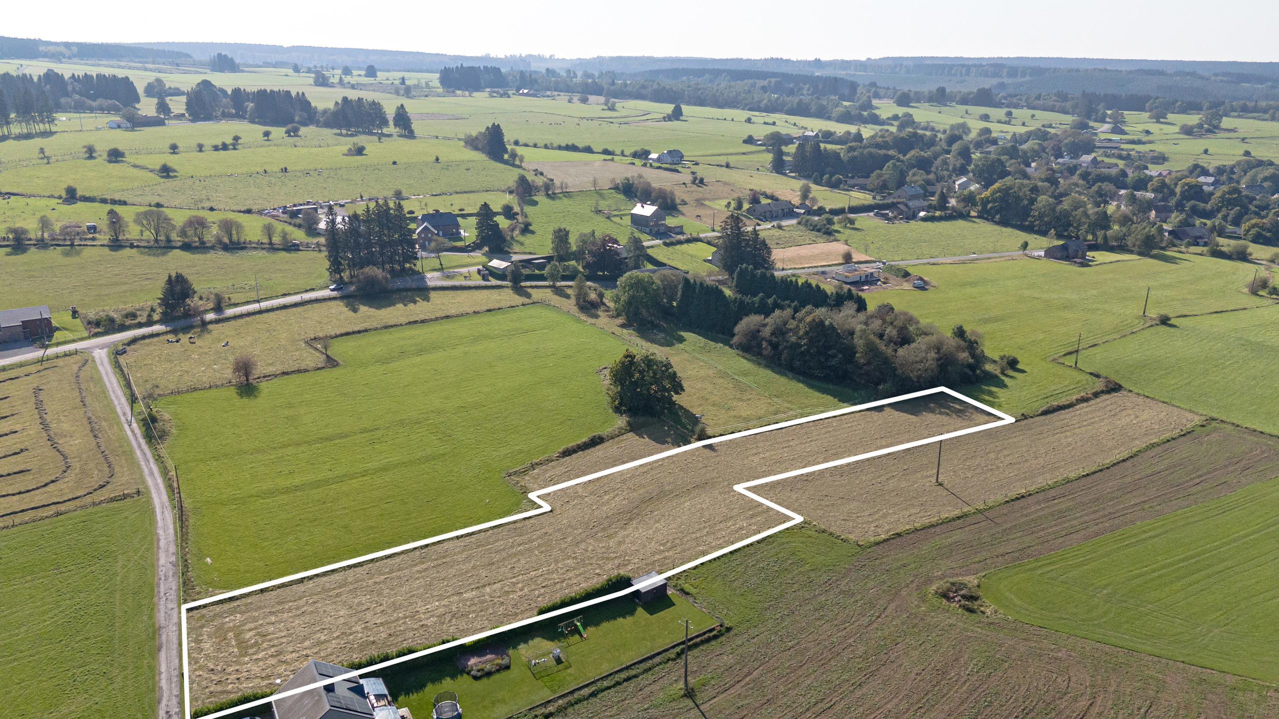 Bouwgrond open bebouwing op perceel van 5.751m² te Manhay. - foto 2
