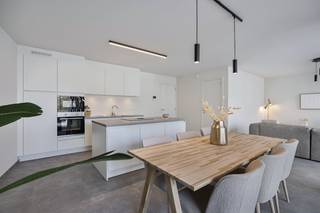 Van de hand van Berkein Architects is located in the heart of De Panne Residence Georges. This small-scale residence includes 11 high-quality Ben apartments with 1 or 2 bedrooms, of which only 3 are still available!The residence itself is located along the Zeelaan in De Panne. In this ideal location, the market is nearby and the beach and dunes are within walking distance. Here you can fully enjoy everything that the bustling coastal municipality of De Panne has to offer you!Thanks to the private solar panels and four-season glazing, the apartments will meet the BEN (Almost Energy Neutral) standards. This (model) apartment has already been fully painted and equipped with lighting.LAYOUT:> First floor:- Entrance hall- 2 bedrooms- Separate toilet- Bathroom with shower- Bright living space, divided into a sitting and dining area with an installed kitchen with island- Storage> Ground floor: easily accessible bicycle parking.> Basement: private storage.Looking for a (second) home by the sea? Make an appointment quickly to see together every apartment that suits you best!This project also qualifies for the 6% VAT scheme! For more information, please contact our office at 058 330 600.