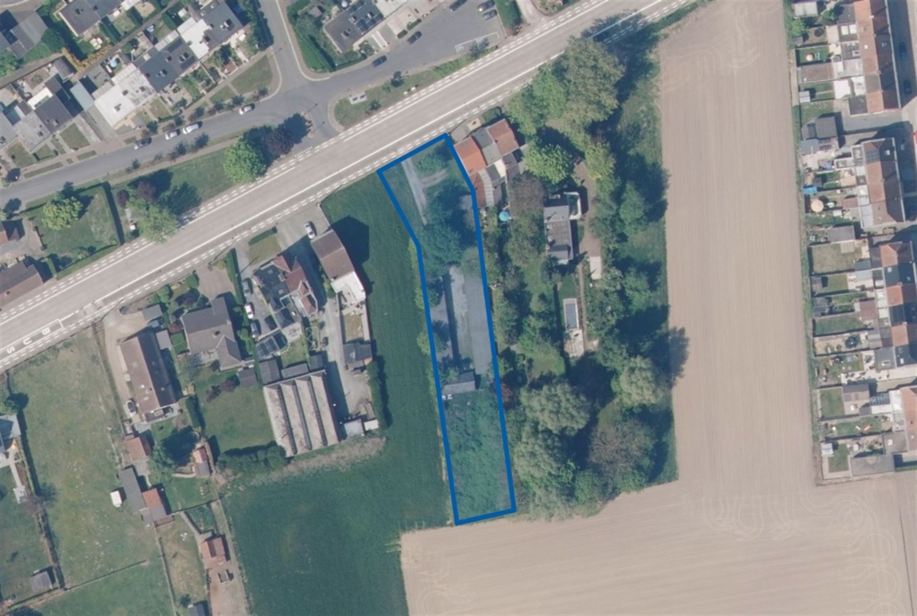 Ideale investering bouwgrond met 20 achterliggende garageboxen - foto 2