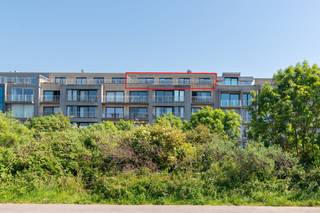 This penthouse apartment for sale is located on the fifth floor of Residentie Seaside (2006) along the Driftweg in Bredene. <br />Enjoy ultimate exclusivity with an elevator that opens directly into your penthouse. Thanks to the two magnificent terraces (45m² and 60m²), you can enjoy the sun all day long. At the front, you will also be treated to a beautiful dune and sea view. <br /><br />Layout:<br />- bright living space with gas fireplace<br />- open kitchen equipped with every comfort<br />- terrace 1 (60m²) with fantastic dune view <br />- terrace 2 (45m²) with an awning and access to the patio shed<br />- storage room with connection for washing machine<br />- night hall<br />- separate toilet with hand wash basin<br />- master bedroom with ensuite bathroom (shower, sink and toilet) <br />- bathroom 2 (bathroom furniture and shower)<br />- bedroom 2<br />- bedroom 3<br /><br />Possibility to purchase a deep garage (10m70), which is easily accessible from the street side.<br /><br />Pros:<br />- EPC label B<br />- compliant electrical inspection<br />- air conditioning<br />- 3 full bedrooms - 2 bathrooms<br />- numerous built-in closets (living room and bedrooms)<br />- beautiful terraces<br />- possibility to purchase a garage in the building<br />- recent building<br /><br />This unique penthouse combines the peace and grandeur of the dunes with the ultimate comfort of a modern, voluminous apartment. An absolute godsend on the coast! Contact us today for an on-site visit and be enchanted by the breathtaking view.<br /><br />Register of measures: no