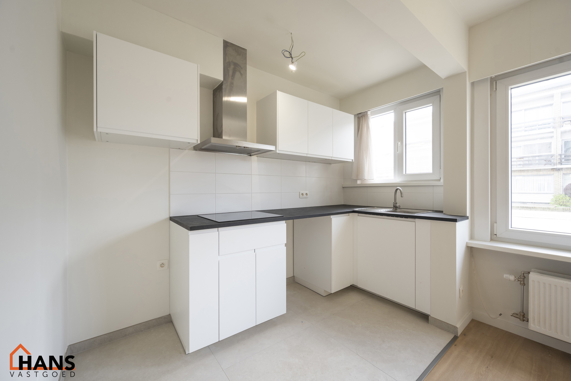 Gerenoveerd gelijkvloersappartement met garagebox. - foto 4