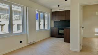 This renovated one-bedroom flat, measuring approximately 52 m², is situated on the third floor of a fully renovated apartment block in the heart...